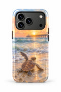 Juno Pier Sea Turtle Sunrise tough phone case, back view on white