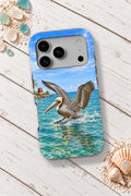 Key West Pelican Landing tough phone case on a white wooden table