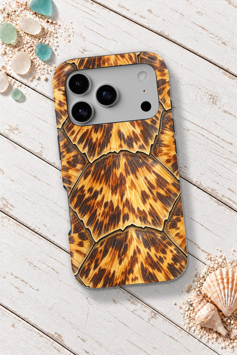 Keys Hawksbill Tortoiseshell tough phone case on a white wooden table