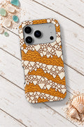 Cloth of Gold Cone Shell tough phone case on a white wooden table
